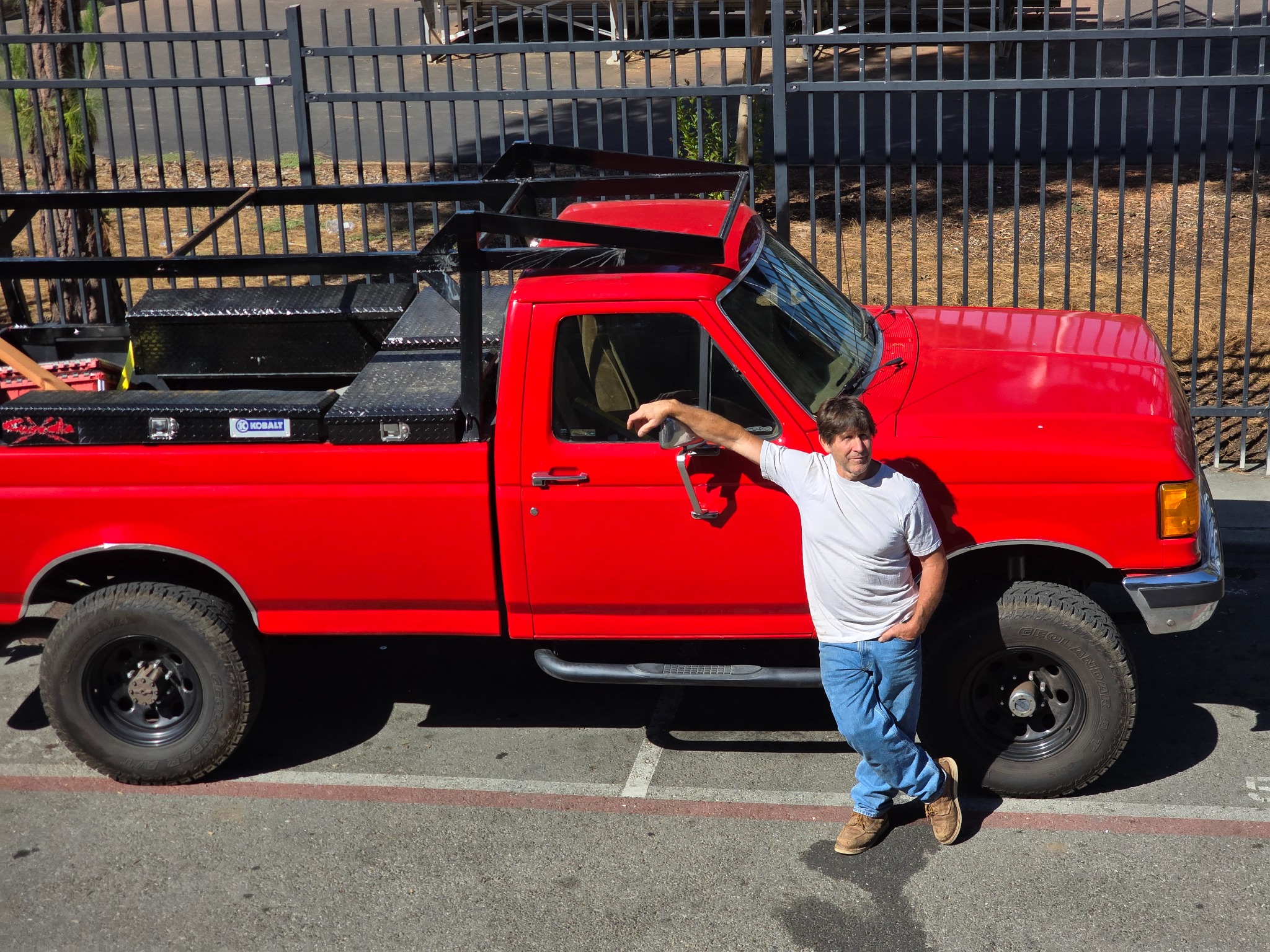 Steve Guzzetta with his red work truck