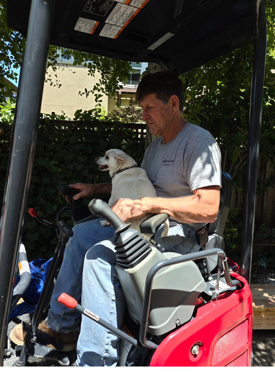 Steve Guzzetta operating a mini excavator on a South Bay jobsite