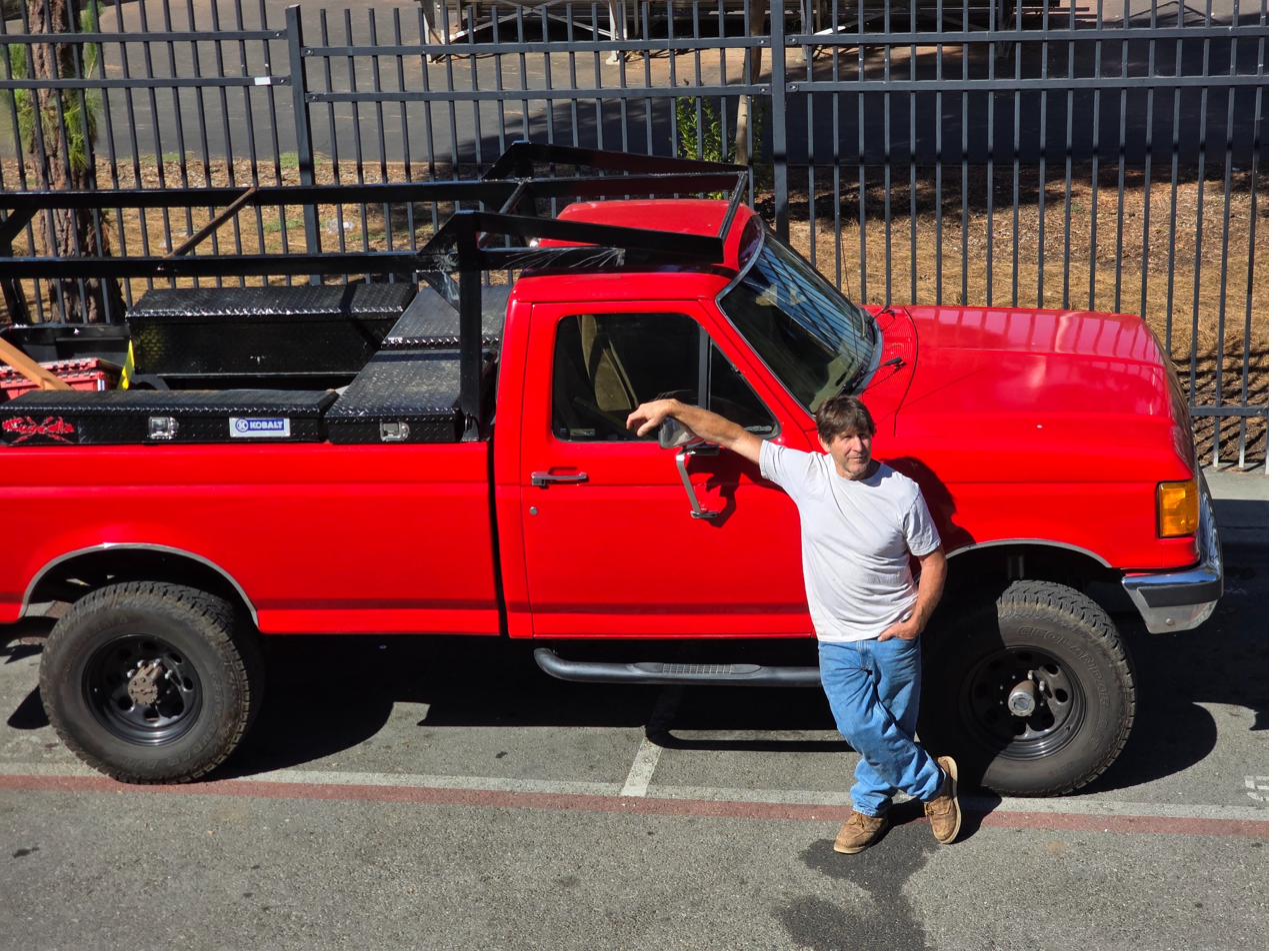 Steve Guzzetta with his red work truck